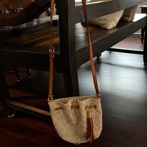 Michael Kors small cross body draw string bag